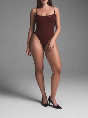SKIMS Lace Bodysuit in Oxblood